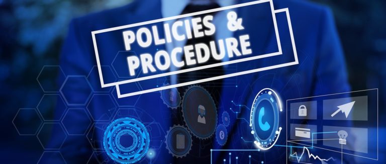 Man holding a design that labels Policies and procedures in blue, what it is and how it works.