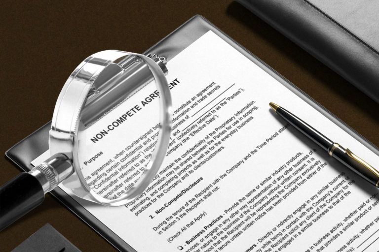 magnifying glass showing non-compete agreement form