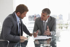 An employee negotiating their severance package with their boss