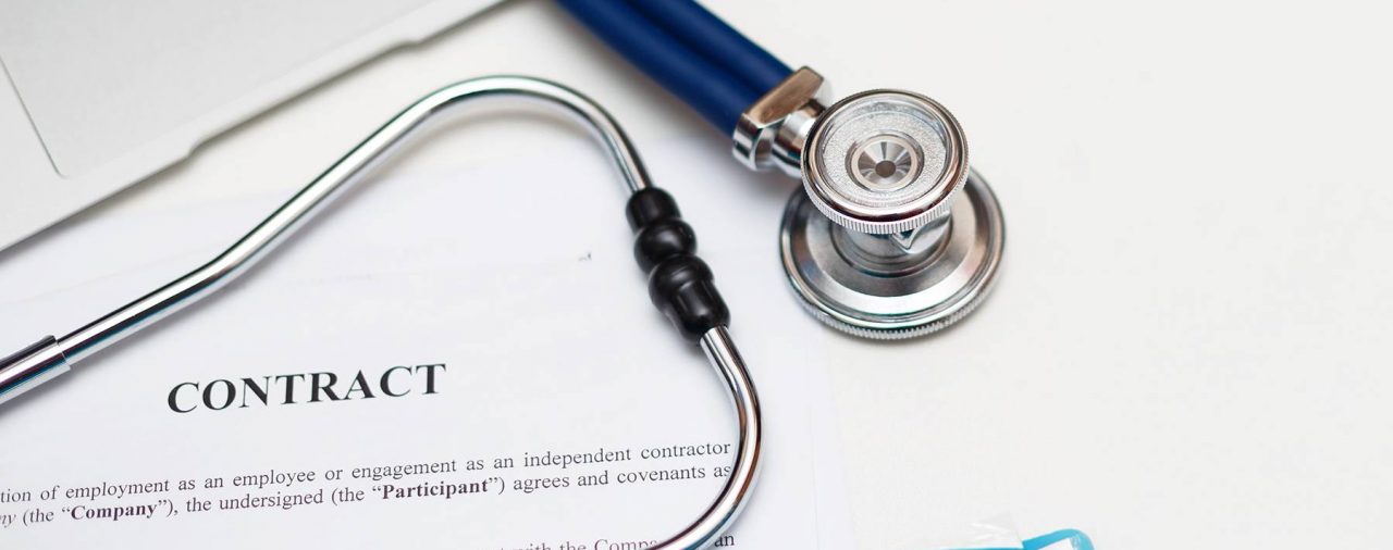 Physician contract with a stethoscope. Symbolizes medical professionals role in physician contract review