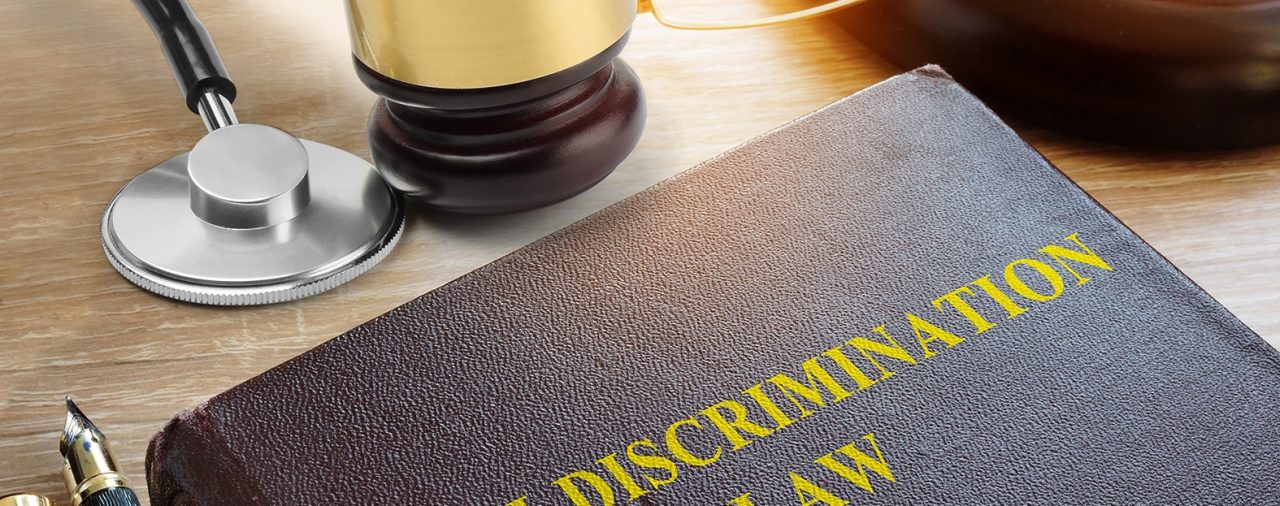 Anti Discrimination Law on a table. Equality concept.