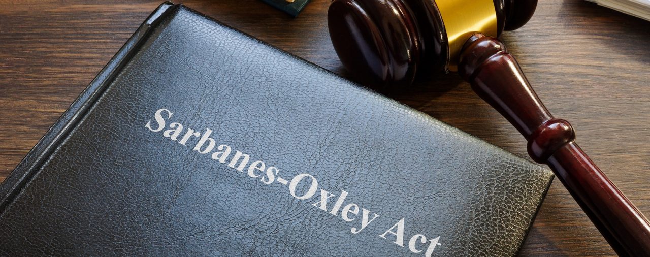 Sarbanes-Oxley act. Book with laws and gavel on the table.