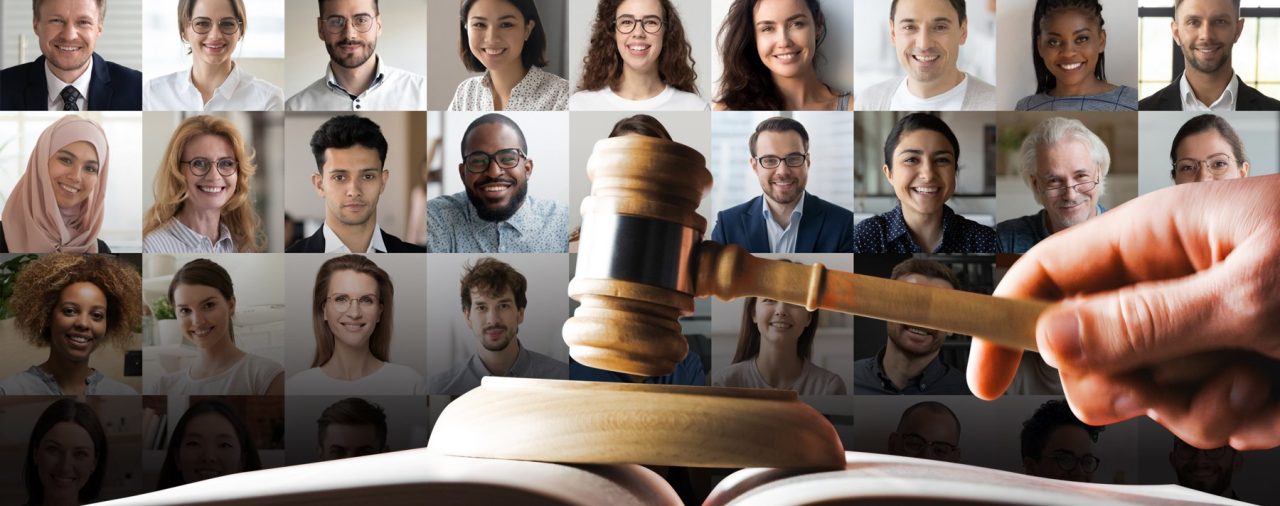Image shows variety of different classes in the background with gavel pounding in the front. Conveys effects of Affirmative Action being repealed on workplace diversity.